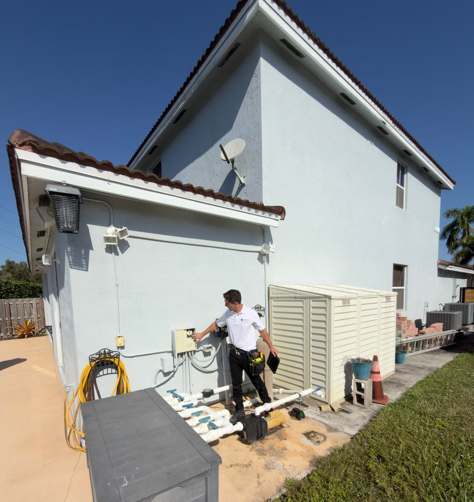 Inspector checking exterior pool pump equipment